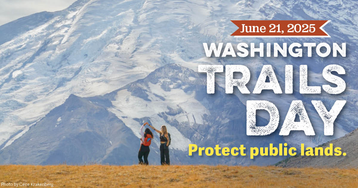 Photo of two hikers dancing against the backdrop of a snowy mountain with the text "June 21, 2025. Washington Trails Day. Protect public lands. Photo by Cece Krakenberg."