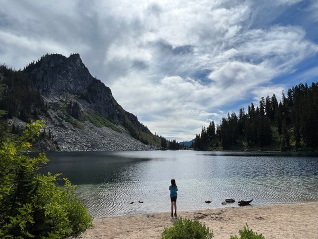 A child looks out on the beach view at Lake Valhalla. Photo by ninjaracerchick.