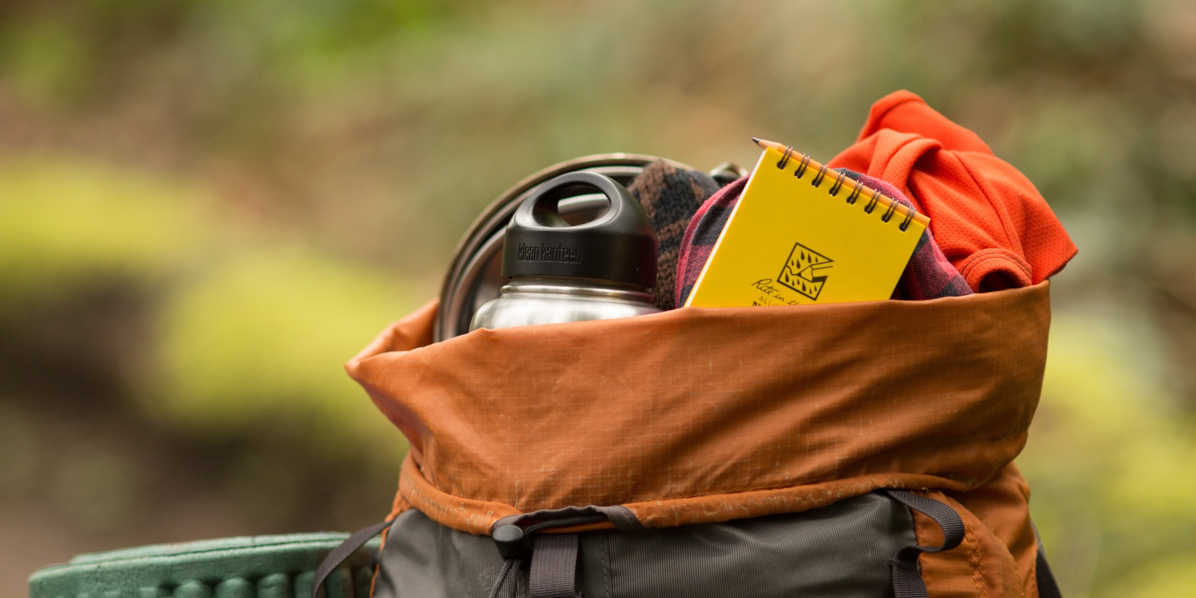 A backpack with gear, including a Rite in the Rain notebook in it. Photo by Emma Cassidy.