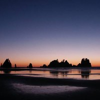 Point of Arches at sunset from Shi Shi Beach. Photo by Carlos Maxwell.