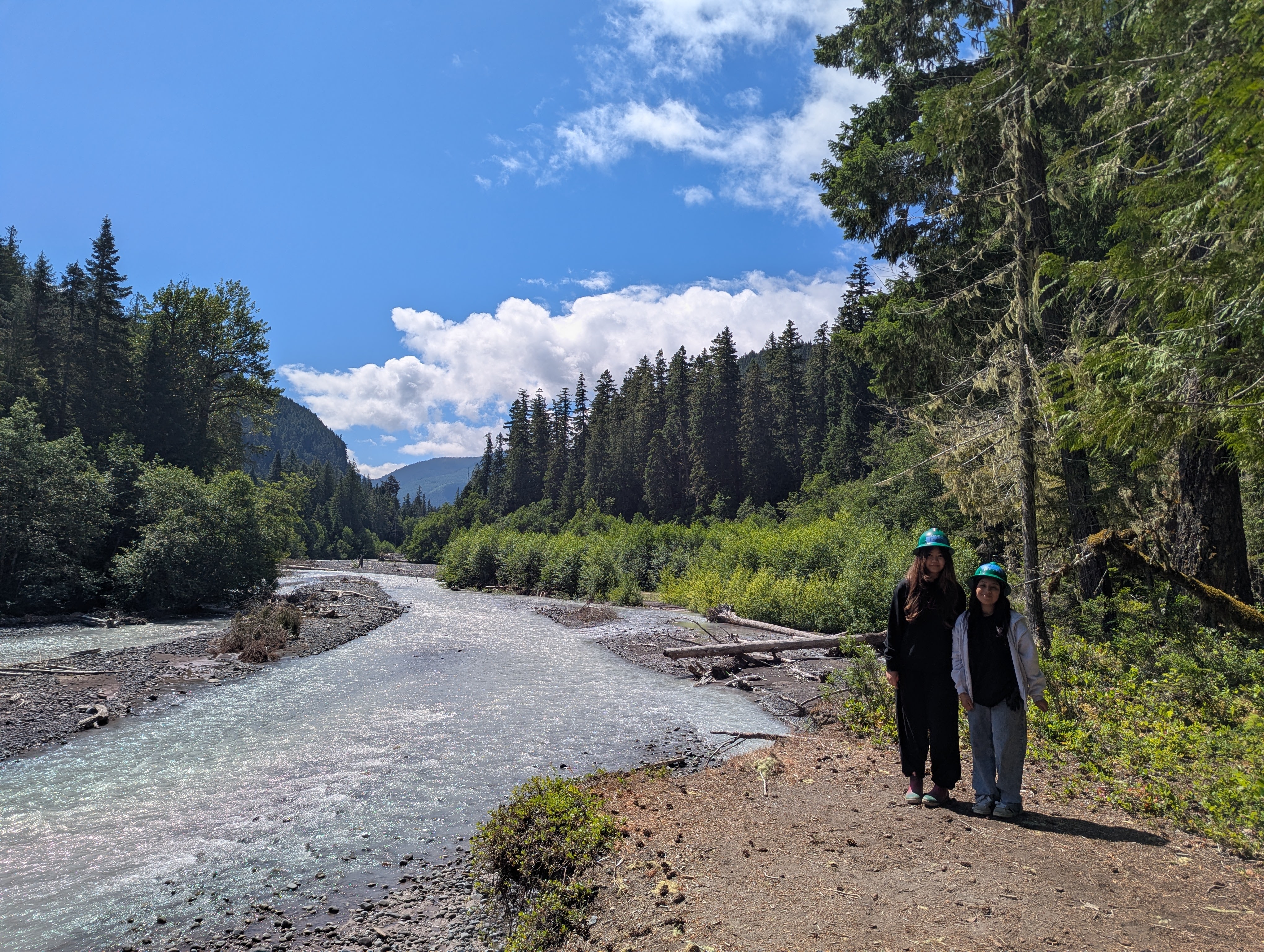 Trail volunteers with a river view