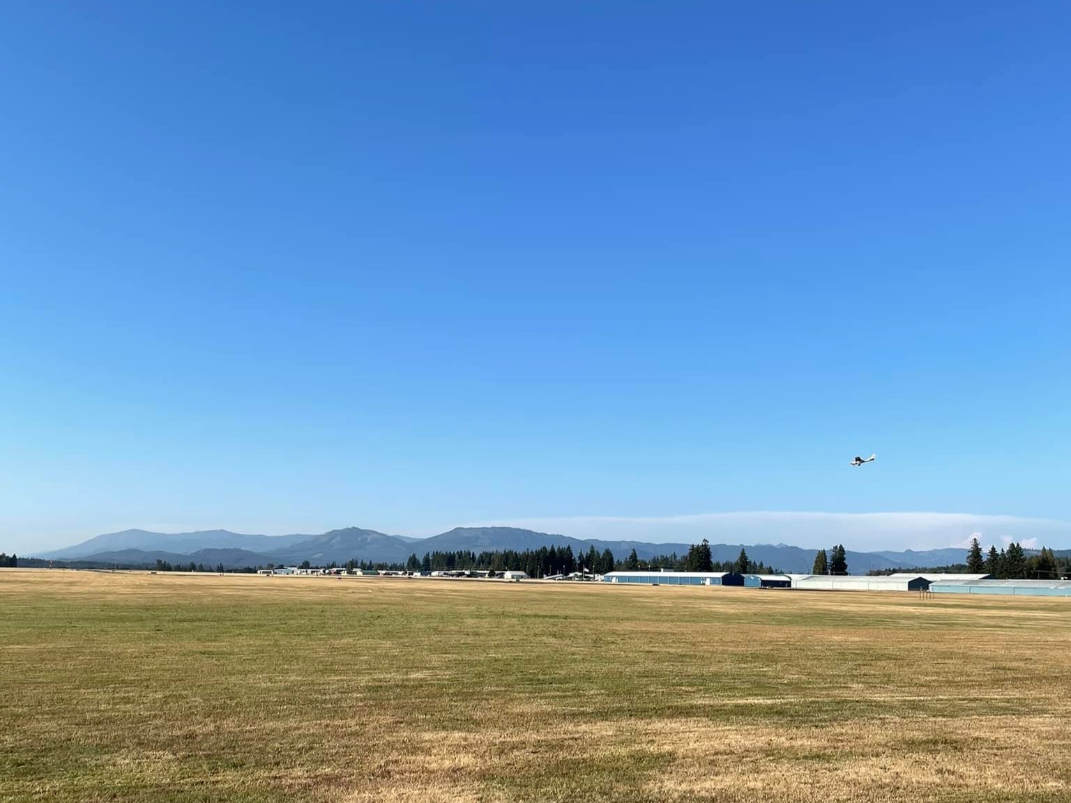 Arlington Airport Trail. Photo by Megan Joann Rice. A plane in the air, photo taken from the Arlington Airport Trail. Photo by Megan Joann Rice.