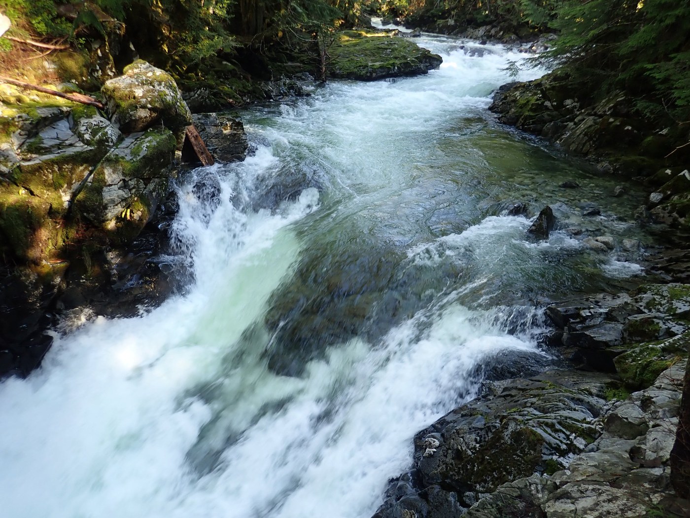 A river starts falling down a waterfall. Photo by zaranth. 