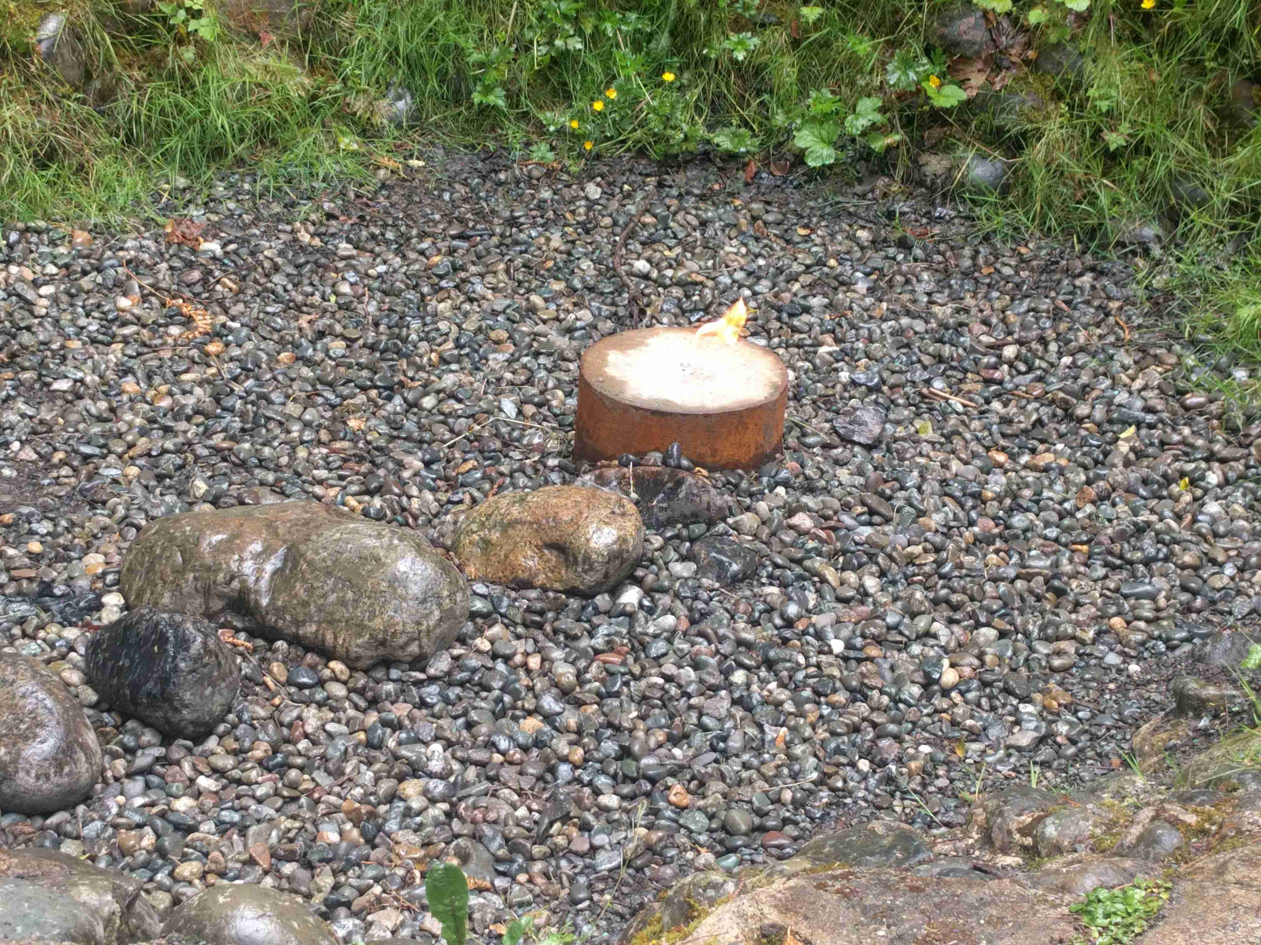 Small fire in the flaming geyser of Flaming Geyser State Park. Photo by DGolding.