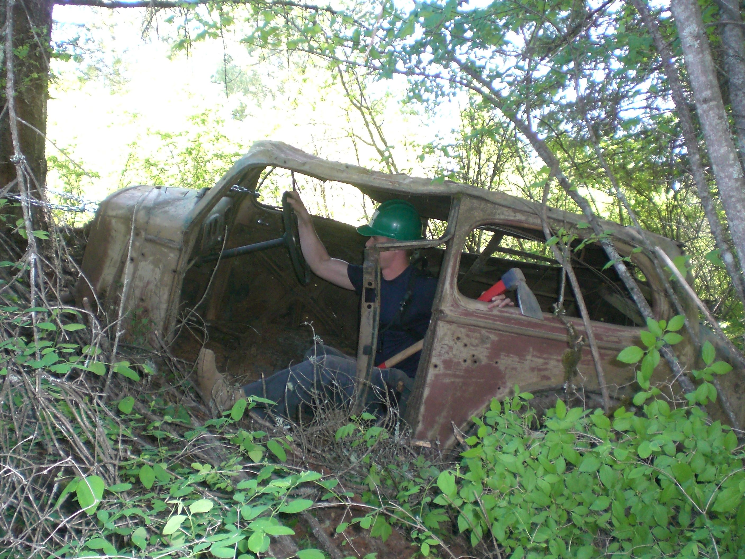 Abandoned 1930s car on the Split Creek Loop trail in Liberty Lake Regional Park. Photo by Holly Weiler.