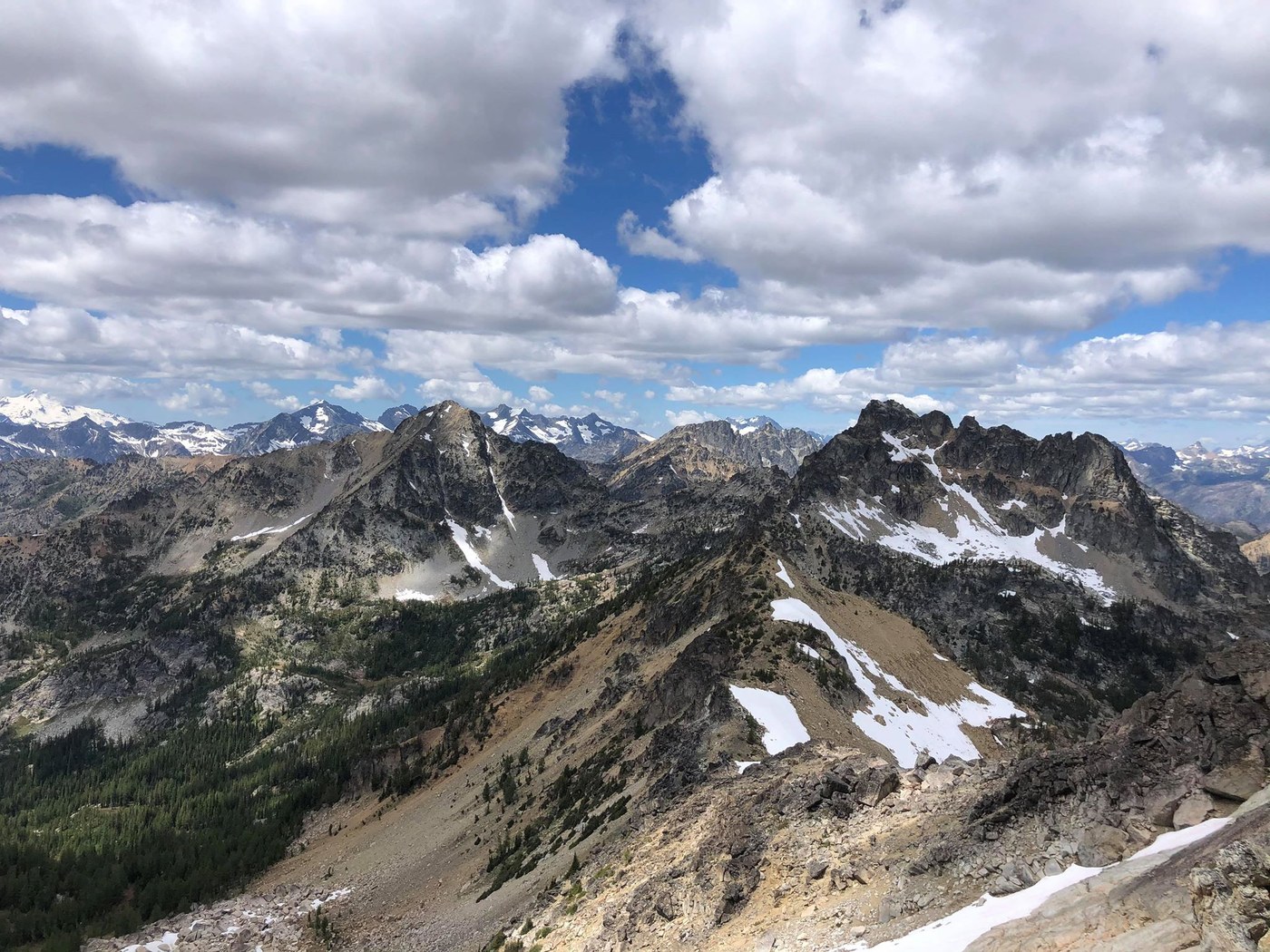 A view from high up on a peak, overlooking the surrounding rocky peaks and river valleys of the Entiat.