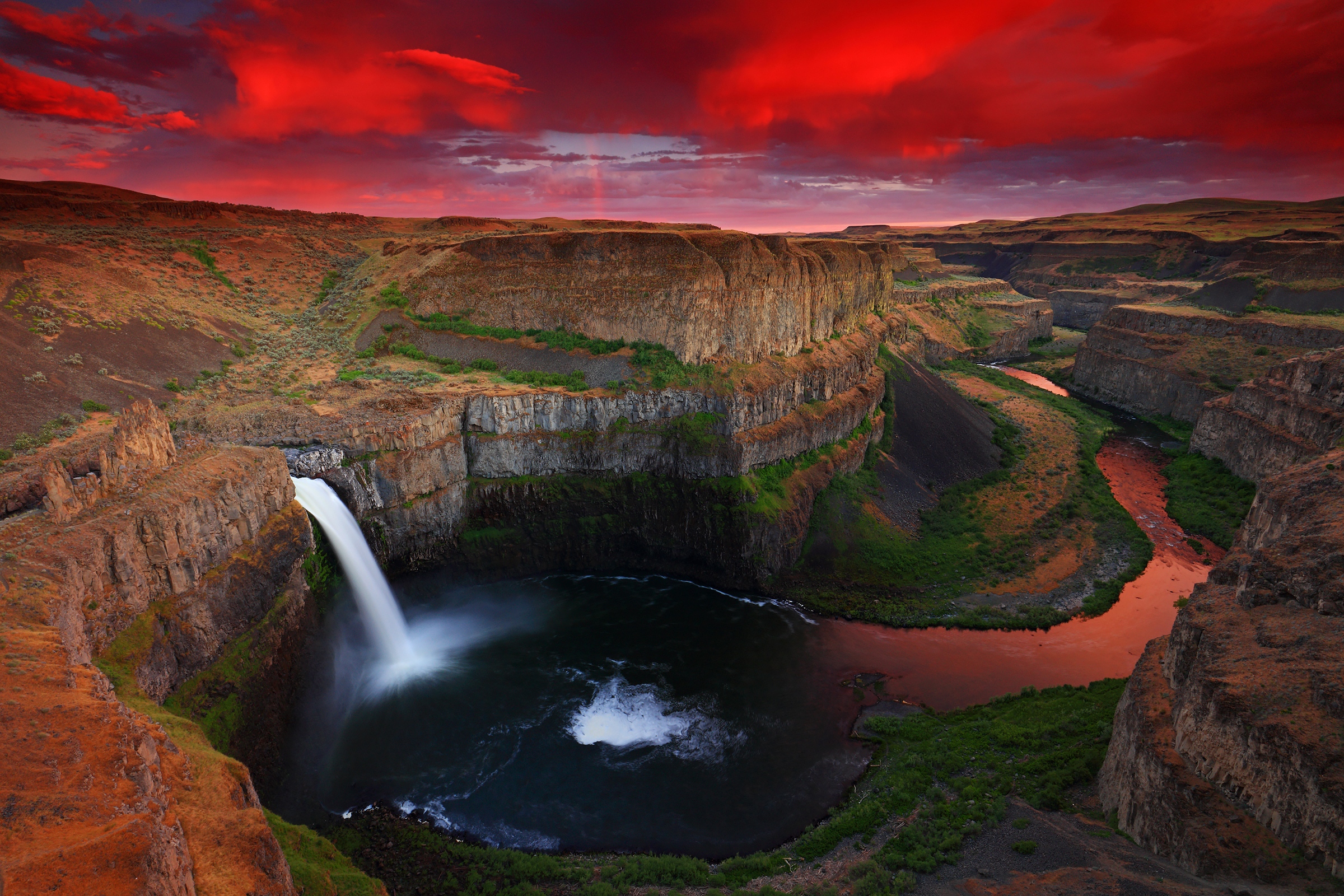 Palouse Falls. Palouse Falls as sun is setting, during a thunderstorm. Photo by Randall Hodges.