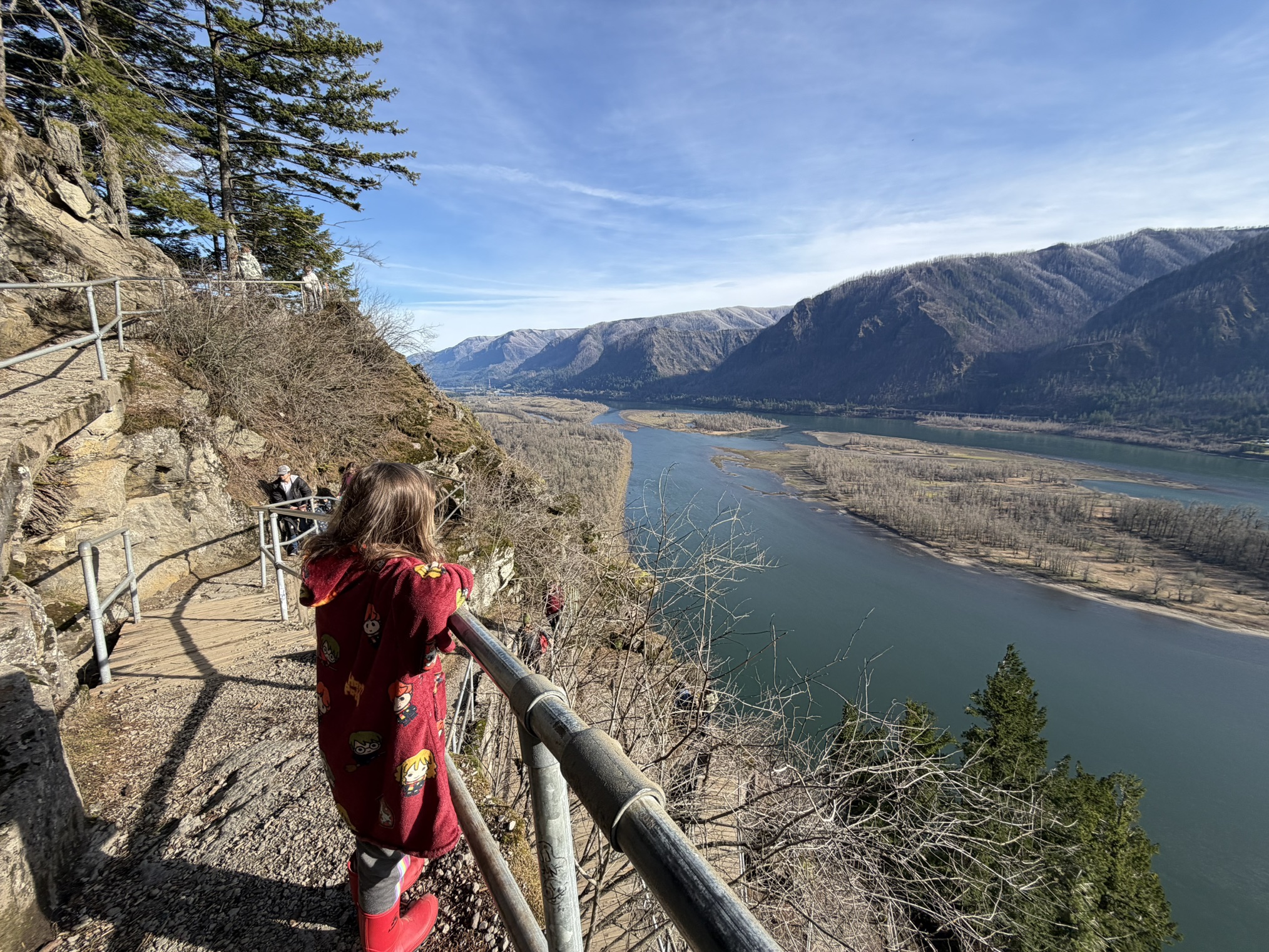 A child looks out at the Columbia River Gorge on the Beacon Rock trail at Beacon Rock State Park. Photo by trip reporter Ryan Ojerio.