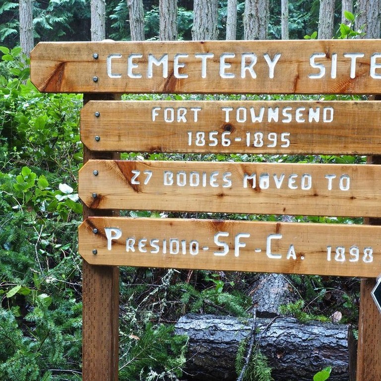 A trail sign at Fort Townsend Historical State Park shares different trails and directions.