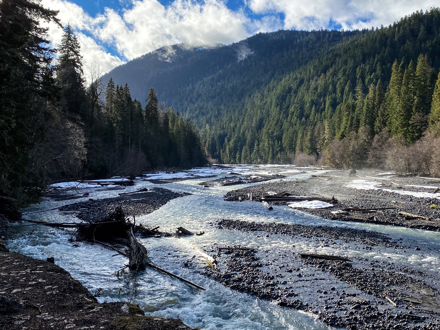 Mather Memorial Highway Snowshoe. LittleAngelsMollie. A river surrounded with snow and icy tree branches.