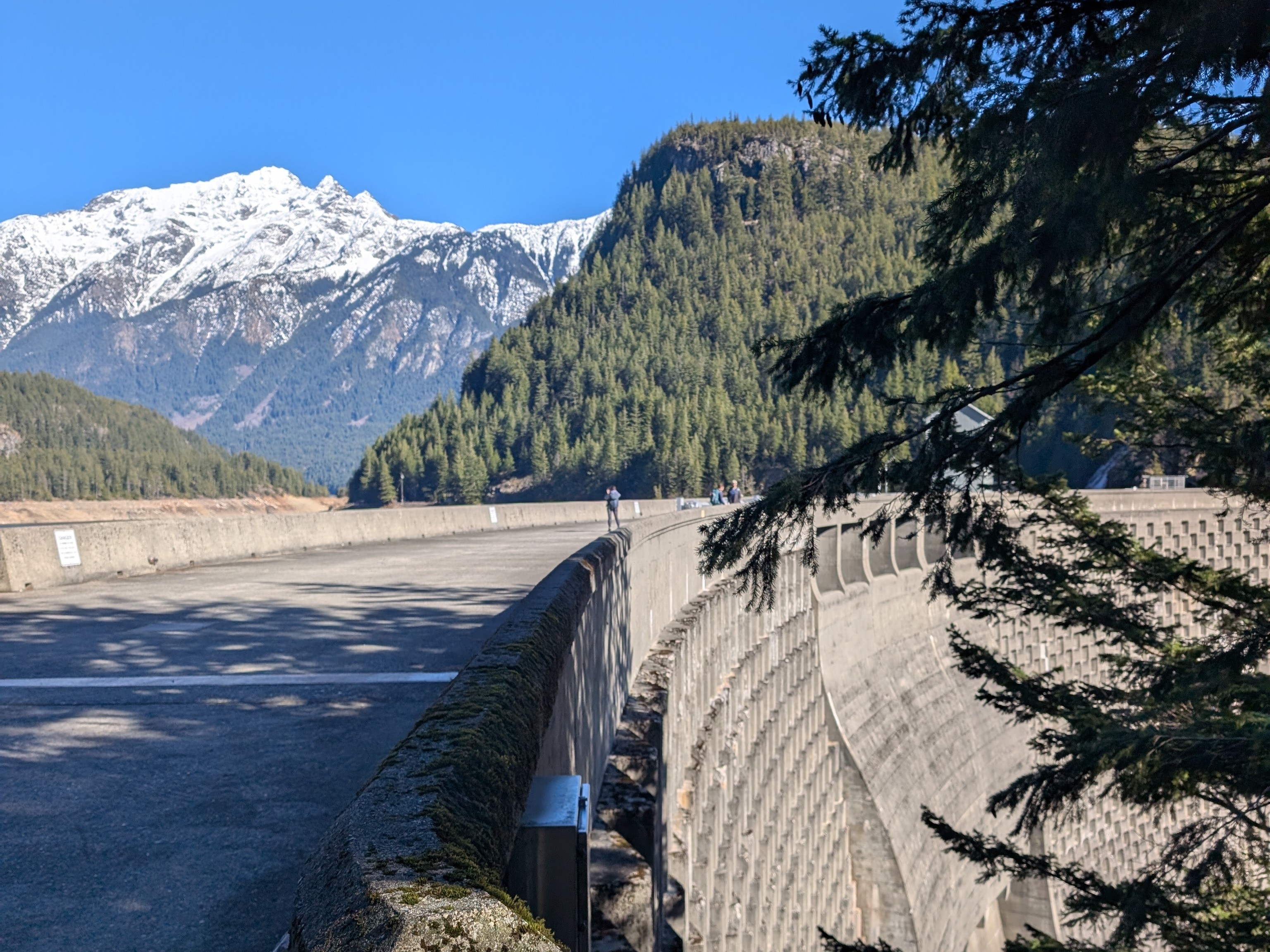 The Ross Lake Dam with North Cascades mountains in the distance. Photo by trip reporter SavvyExploring.