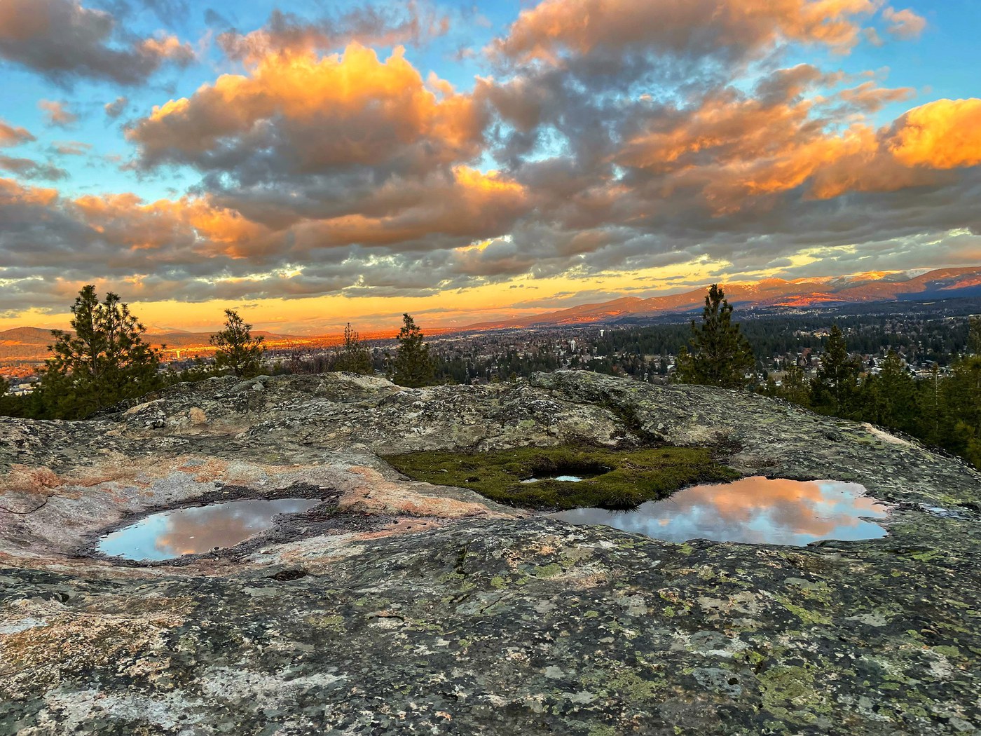 Colorful clouds above rock formations