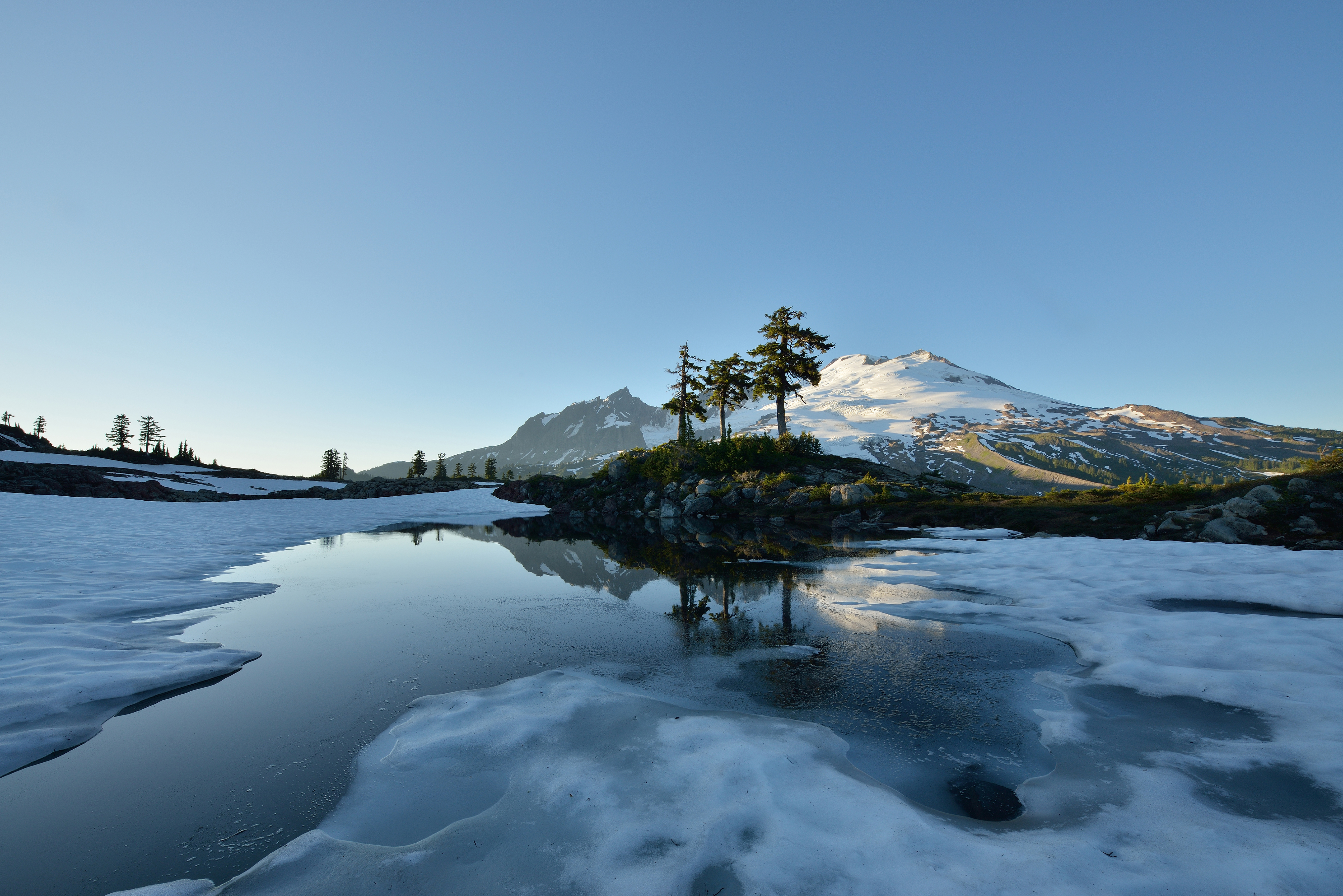 An icy tarn along the Park Butte Trail in late July