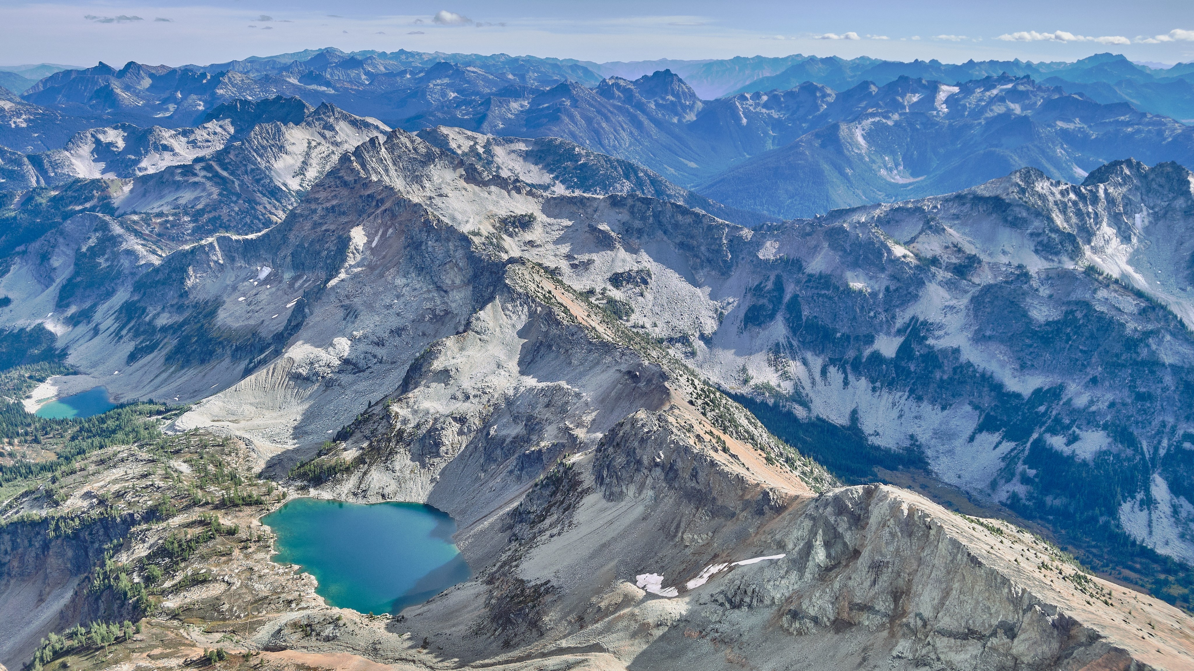 Black Peak by Huy Dang Layers of mountainous peaks with lakes nestled in between