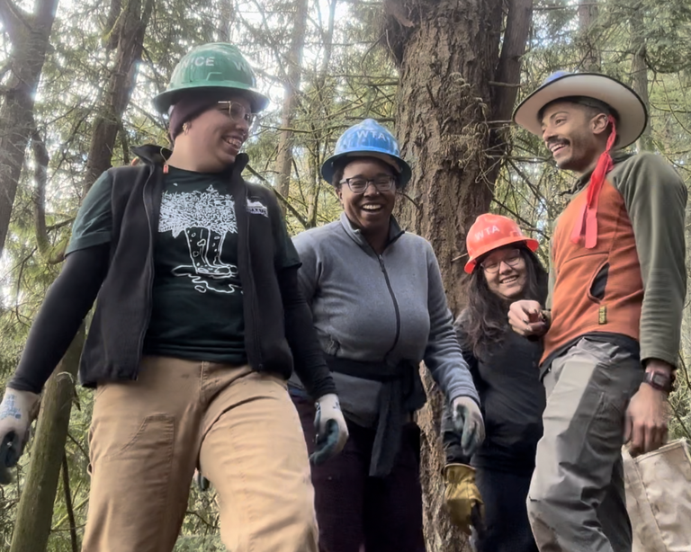 Emerging Leaders Program staff and cohort members laugh while working at Swan Creek Park. Photo courtesy of Angelic Friday.