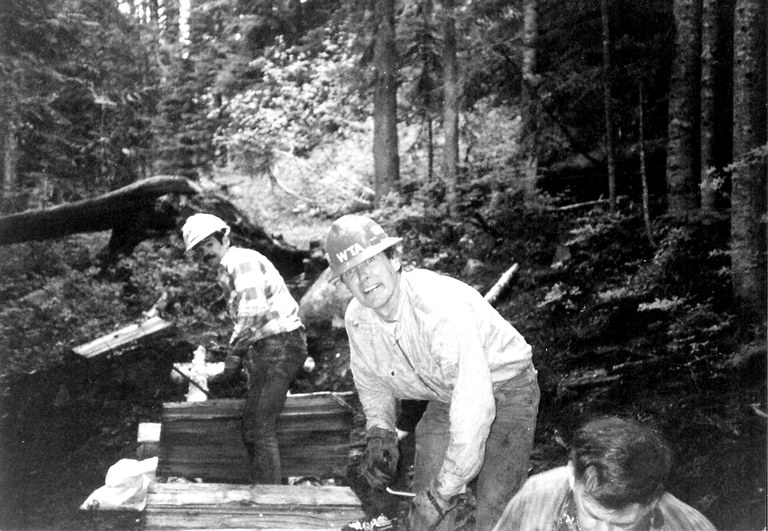 Greg Ball and other trail maintainers work on a structure.