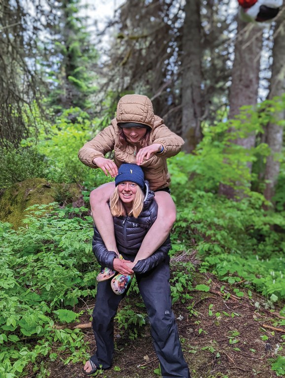 Anna sitting on Kat's shoulders on a Lost Trails Found hitch. Photo by Zachary Toliver.