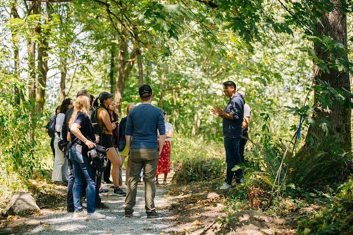 Jaime Loucky speaks at the unveiling of King County Extreme Heat Mitigation Plan at Glendale Forest. Photo courtesy of King County. WTA CEO Jaime Loucky speaks to hikers on a trail.