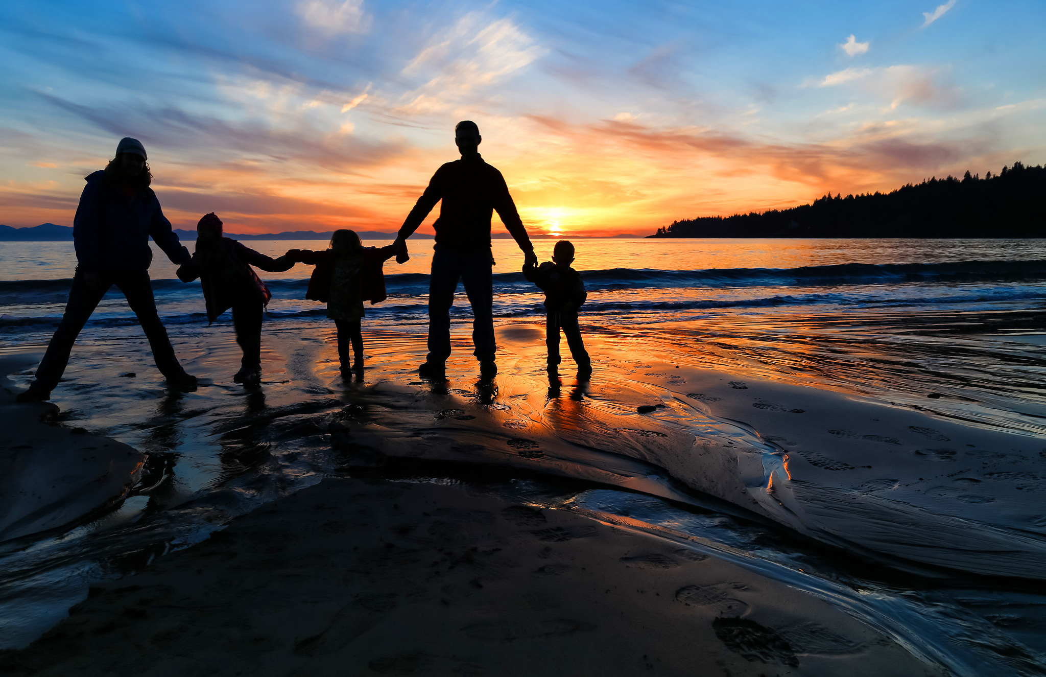Family on the beach. Photo by Brian Koning.