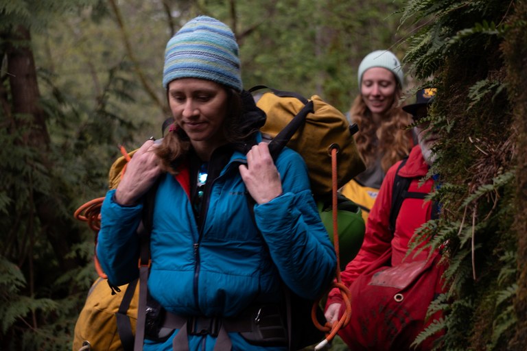 Search and rescue volunteer with a backpack carrying gear. Photo by Jenna Phillips from Seattle Mountain Rescue.
