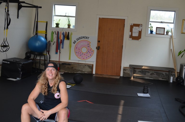 Sophia Walker sits in the gym.