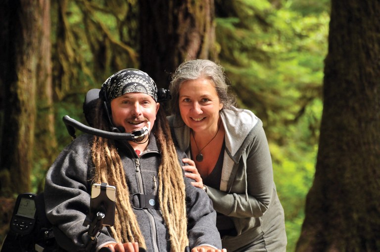 Ian Mackay and Teena Woodward, his mother. Photo courtesy Monte Fitch Ian and his mother with a forested background.