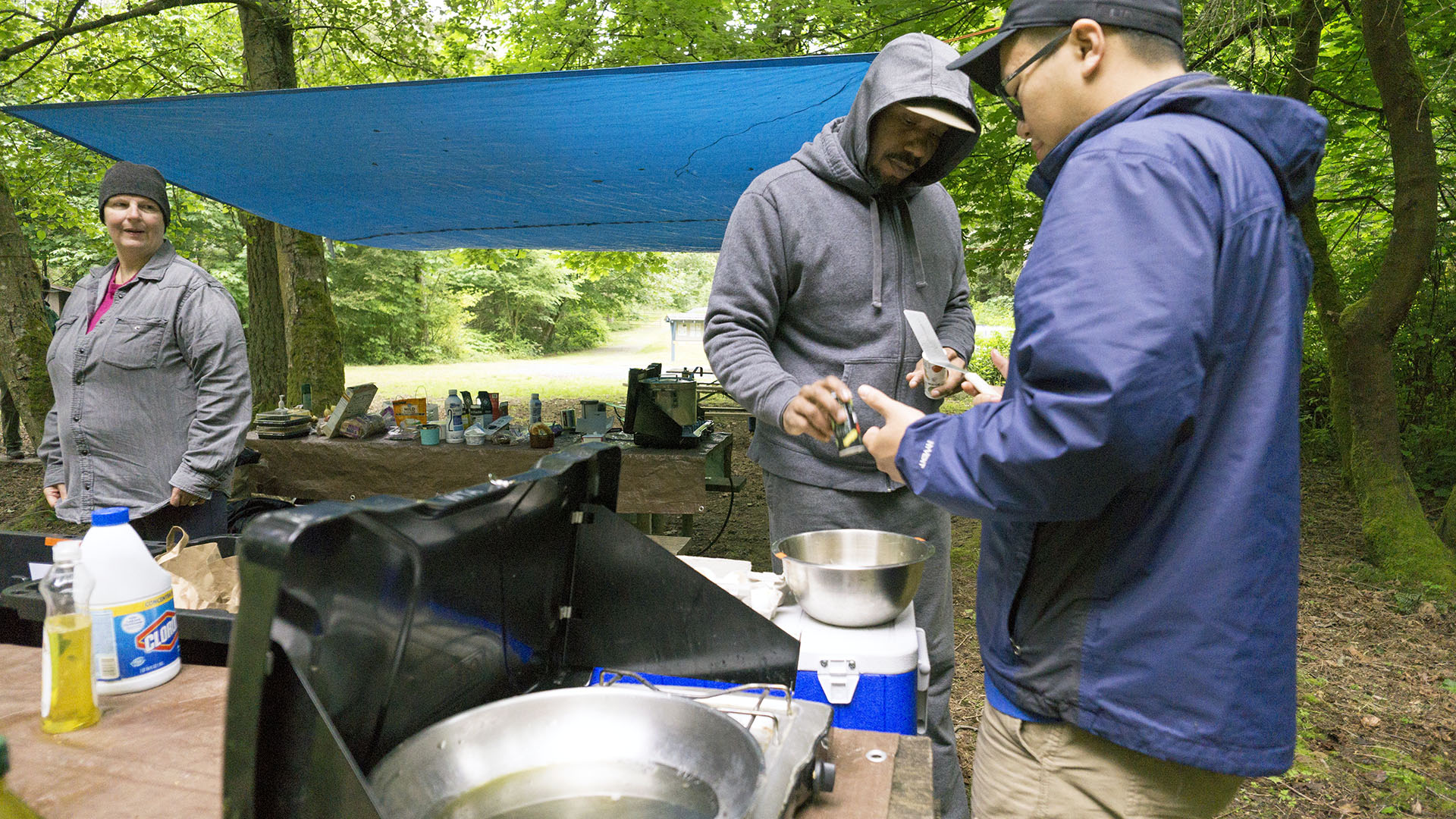 Tarps shown in use at a group campsite