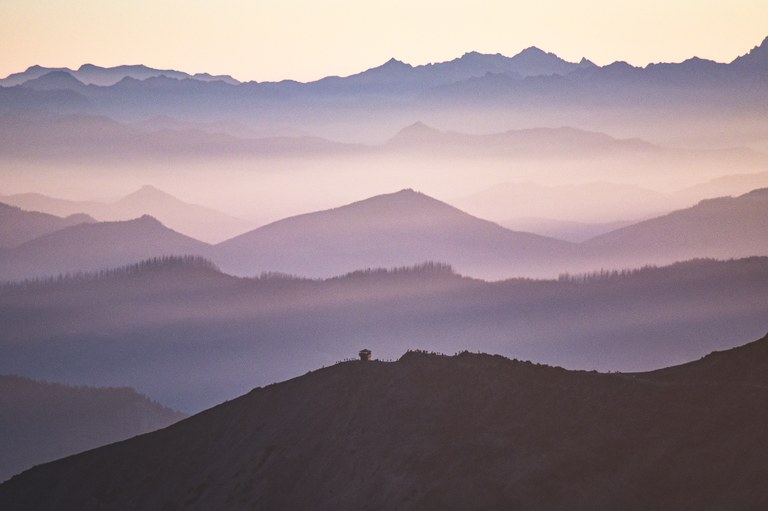Mountain layers in hazy fog