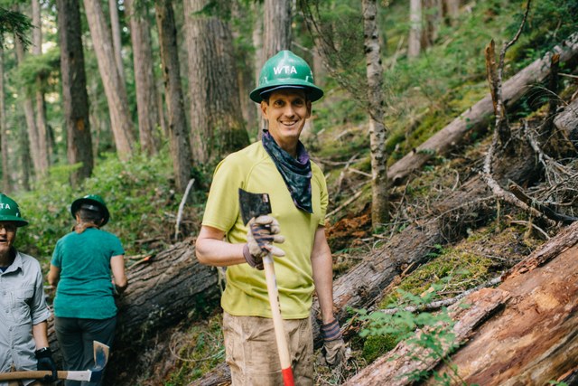 Eric stops for a smile during the day's work. Photo by Karen K. Wang. 