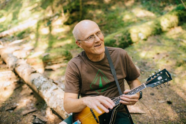 Terry relaxes at camp with some music. Photo by Karen K. Wang.