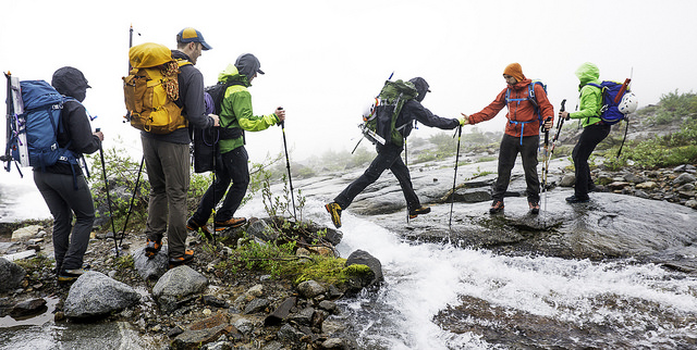 A helpful hand keeps a hiker from a wet landing!  by Mike Warren