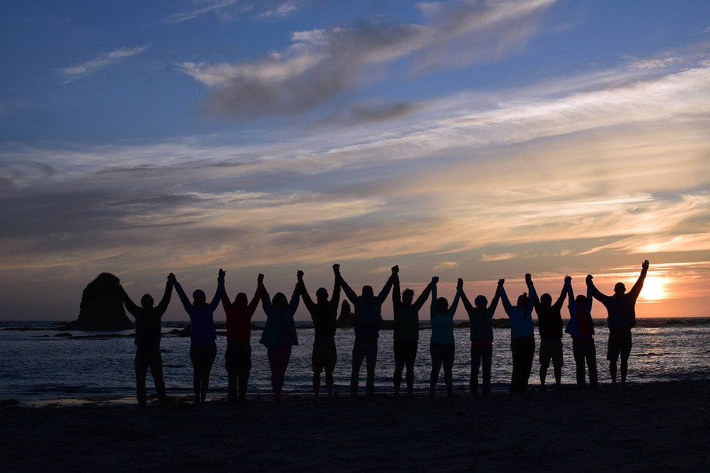 Hiking friends on the coast by Robert Garlow