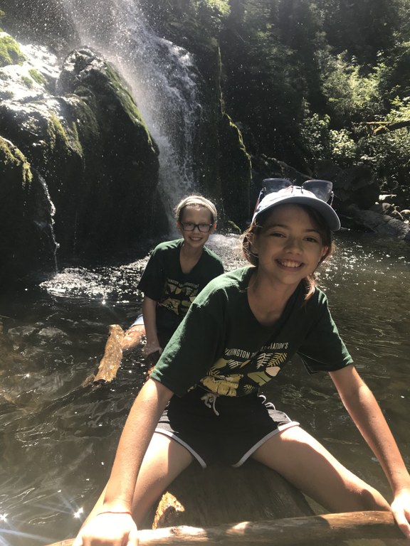 Chloe and Lu cooling off near a waterfall.