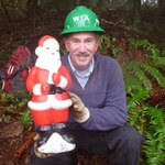 Peter poses with Santa at the 2013 Santa work party in Larrabee State Park. Photo by Jon Nishimura. 