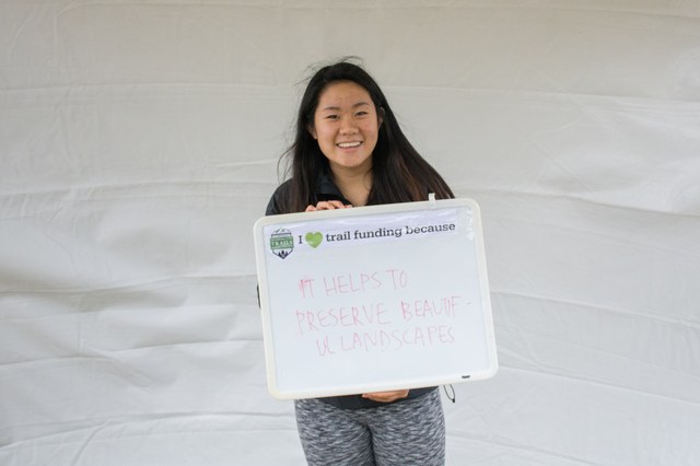 Hiker advocates posed in the photo booth to show their support for trail funding.