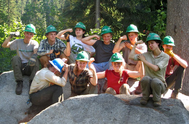 Anna Silver (middle front in red) flexes after a hard day of work on the White River Trail. Photo from WTA archives. 
