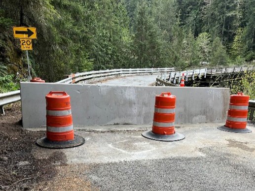 A permanent barricade set up at the edge of the Fairfax Bridge near the Carbon River side of Mount Rainier. Photo courtesy of the Washington State Department of Transportation.~