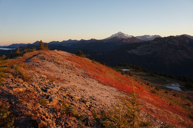 Summit ridge of Benchmark Mountain with Glacier Peak in the distance. This hike, and many others, will be more easily accessible when road repairs are completed. Photo by Martin Bravenboer.