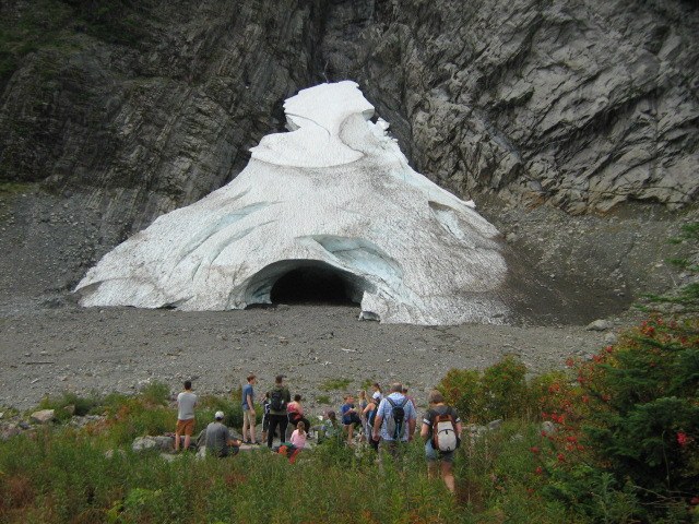 Big Four Ice Caves. Photo by LongWalk. Many hikers a safe distance away from the opening to the Big Four Ice Caves. Photo by LongWalk.