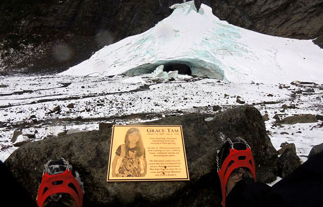 A view of the Big Four Ice Caves behind a memorial for Grace Tam, an 11-year-old who died in a cave collapse in 2010. Photo by GeezerHiker.