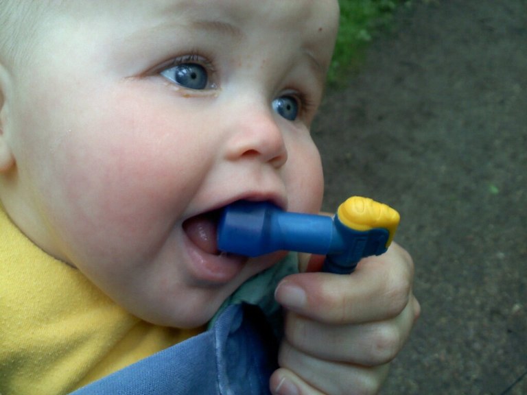 Baby drinking from a Camelbak. 