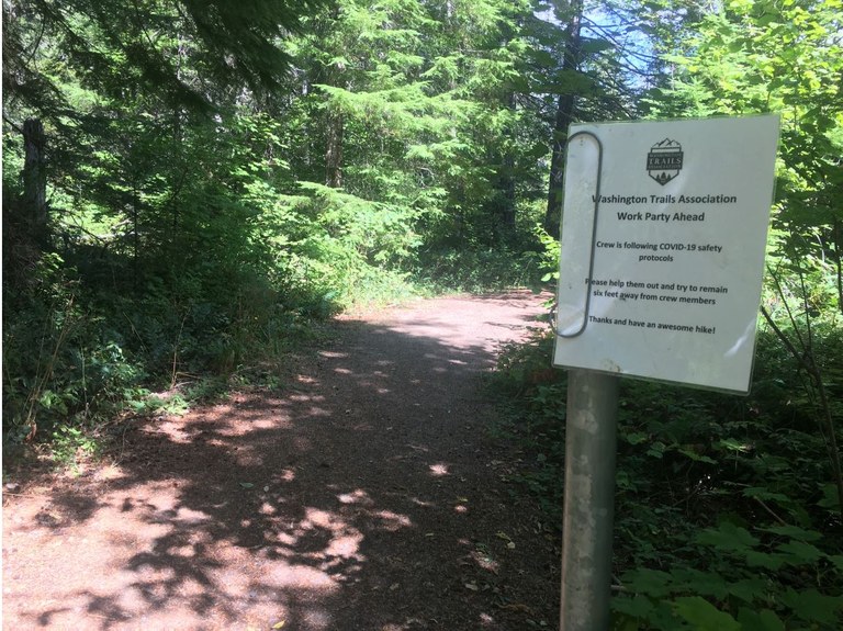 Sign notifying hikers that crew is working according to COVID protocols. Photo courtesy Stasia Honnold.