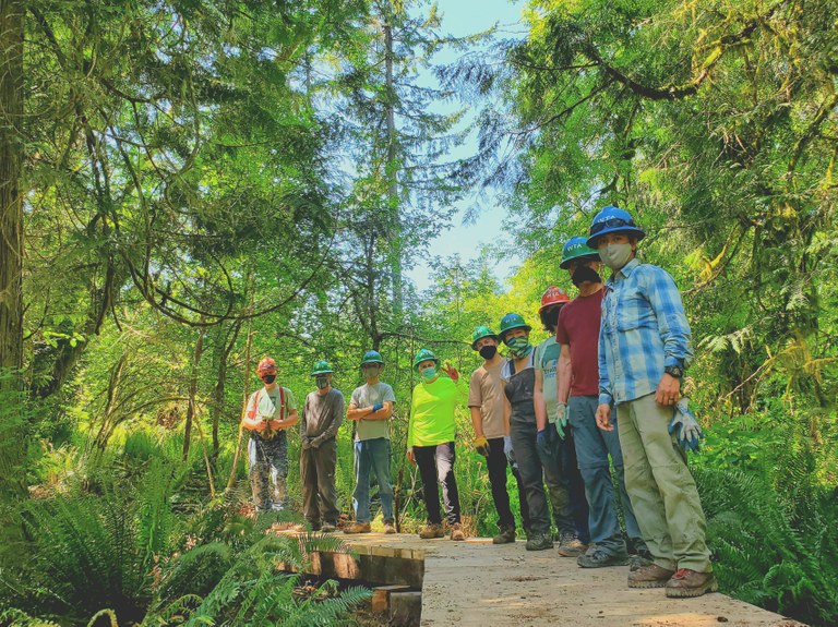 Crew Leader College-Puncheon Construction. Jeremy Tarife. Trail workers lined up along a boardwalk