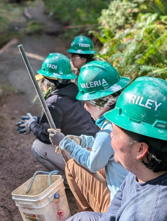 Riley, Teddy, Valeria and Yadi in their green hard hats on the trail. Photo by Tiffany Chou.