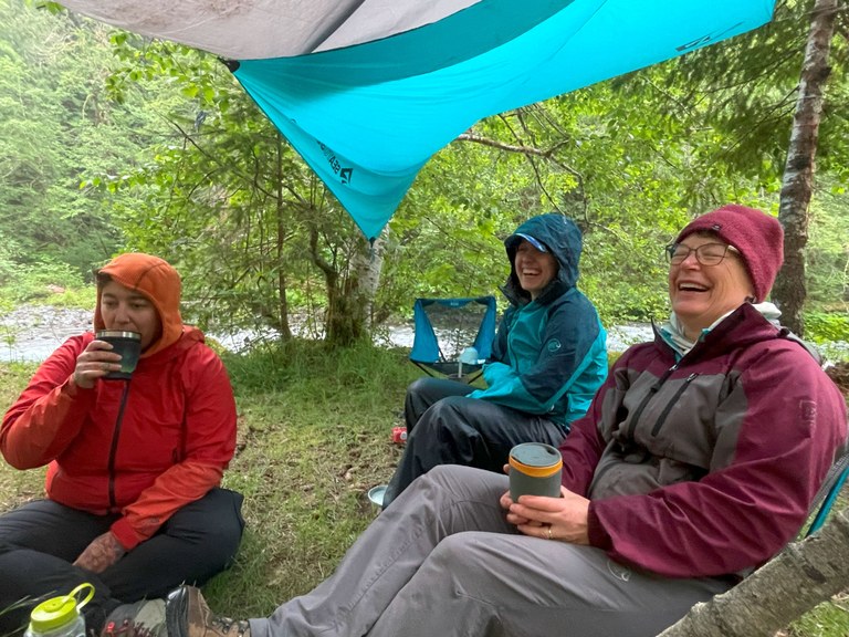 Jess and other trail work crew members at camp on an intro BCRT on the Dosewallips River Road trail. Photo by Elizabeth Storm. 