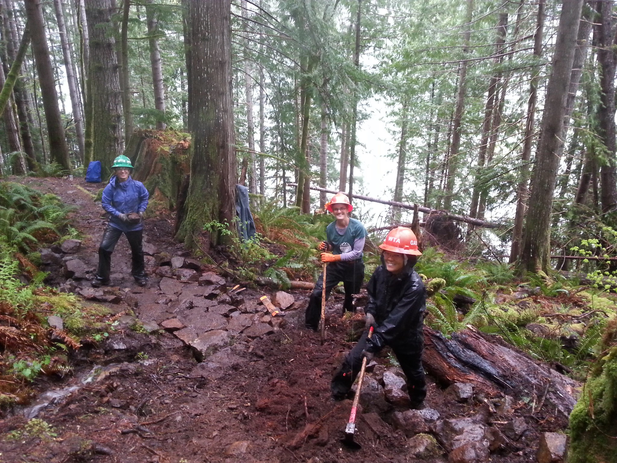Trail volunteers pause with their tools on the Dry Creek Trail in 2018. Photo by Al Mashburn