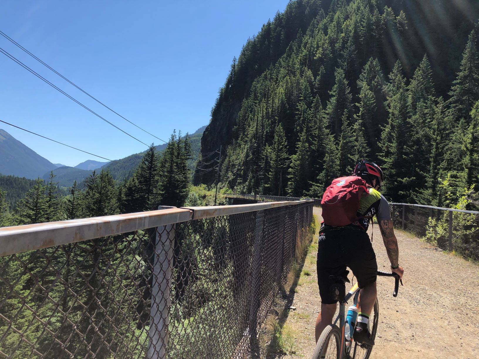Ed Girard Ed Girard riding his bike away from the camera.