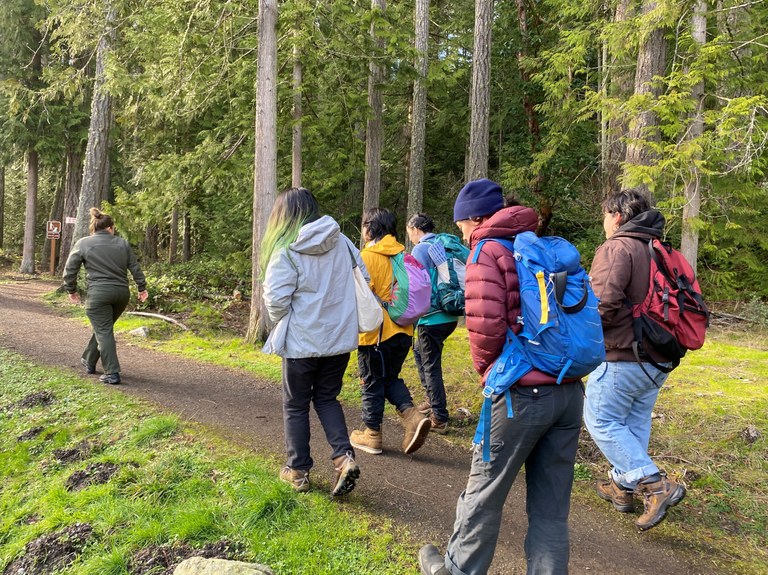 ELP hiking on a trail with a Washington State Parks staff member. Photo by MJ Sampang.