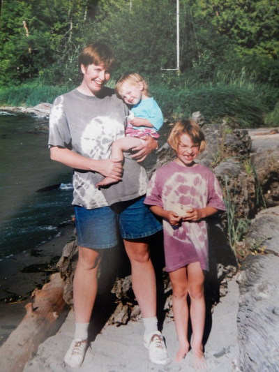 Erin with her mother and sibling on the beach. Photo by Erin McQuin.