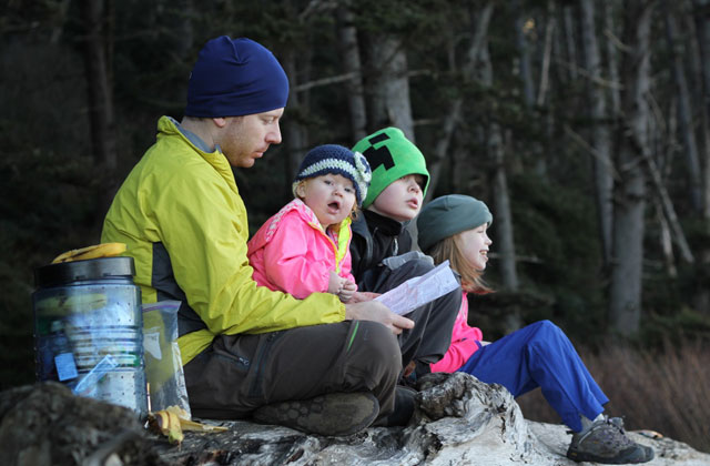 The family takes a break to log their day's adventures on the coast. Photo courtesy Lorelei Felchlin. 